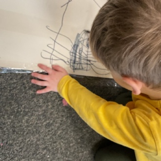 Photo of child adding to school doodle